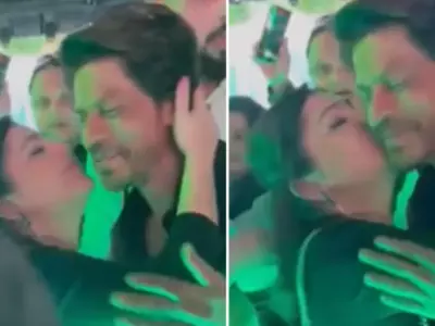 Shah Rukh Khan fans are angry at this woman who grabbed the Jawan star's neck and kissed him forcefully. While SRK smiled at this, fans are furious.