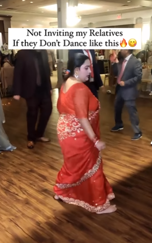 woman dances at indian wedding