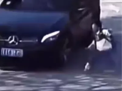 Car Narrowly Avoids Collision With Child