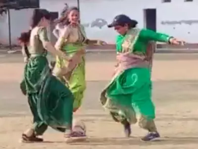 women seen playing football in saree