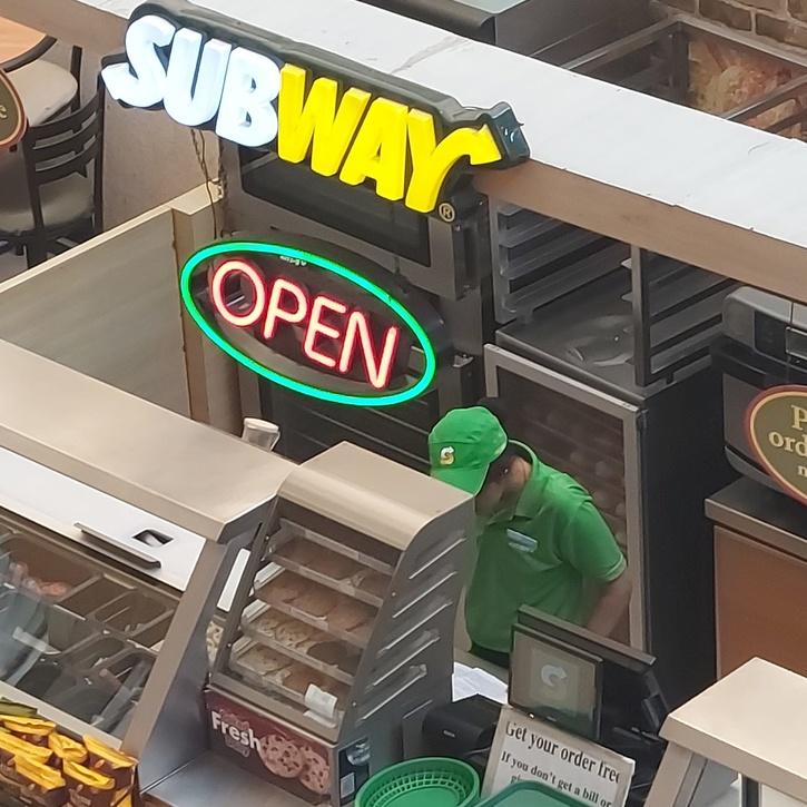 Photo Of Subway Employee Studying Behind Counter Goes Viral