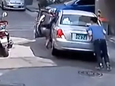 Woman Helps Man Control Runaway Car