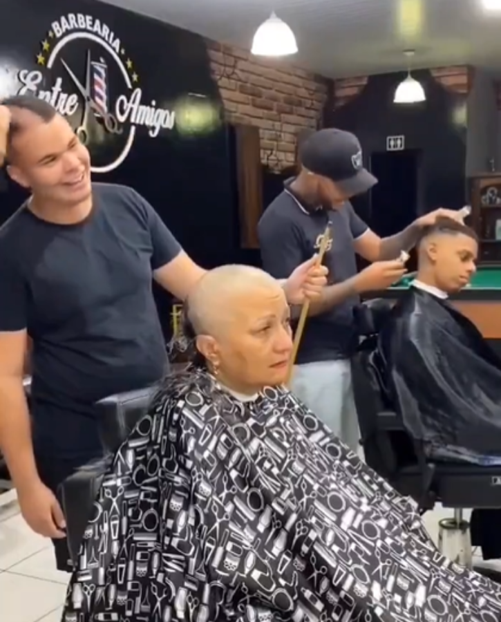 Cancer patient cries as hairdressers shave her head
