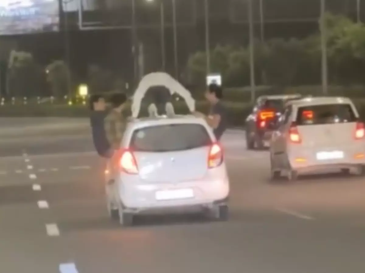 Golf Course Road: Man caught doing push-ups on moving car