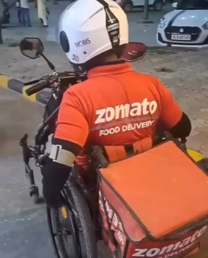 Watch Zomato Delivery Agent Uses Detachable Motorised Wheelchair