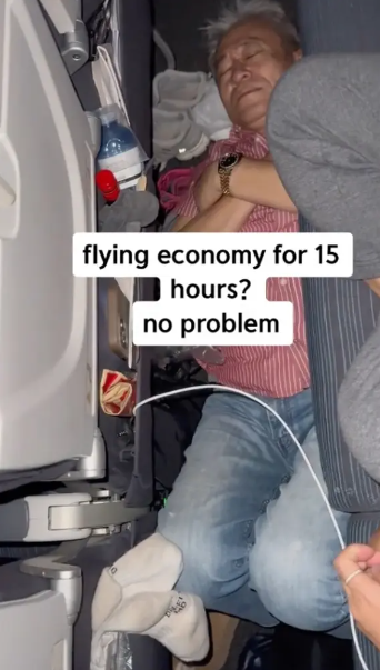 Passenger adopts a strange sleeping position on the plane