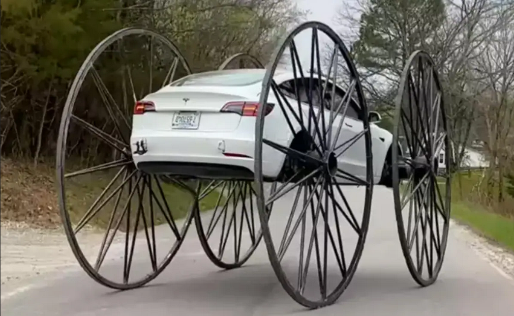 man Made Jugadu Tesla By puting 10ft buggy wheels on tesla car
