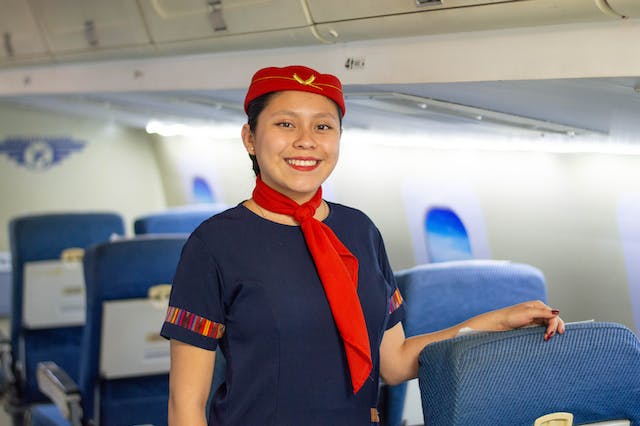 Why do flight attendants greet all passengers?