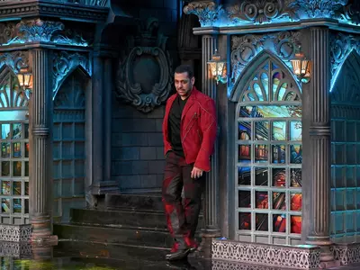 Salman Khan shoots for Bigg Boss 17 premiere episode in red jacket.