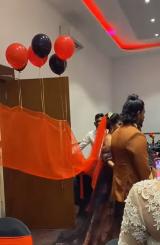 The bride uses balloons to float her veil at the wedding