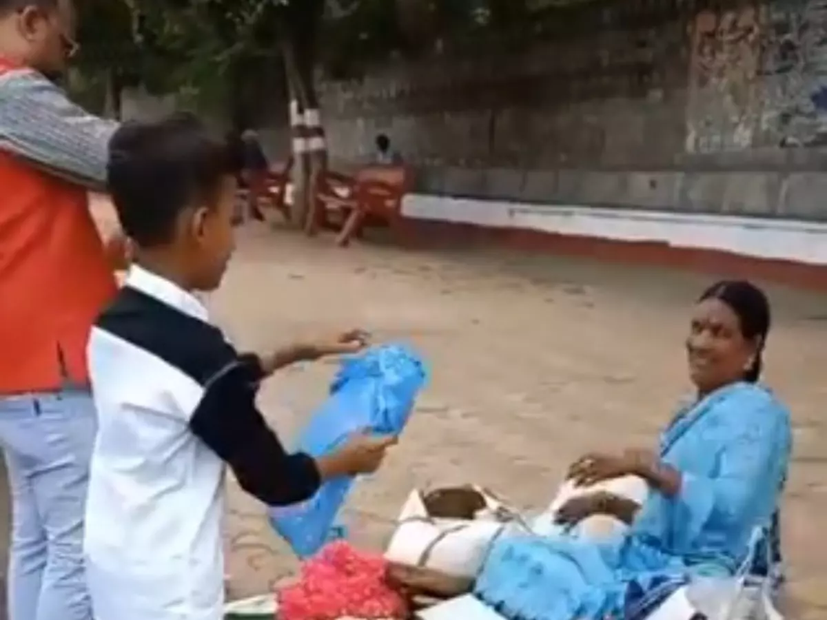 An Elderly Flower Vendor Is Brought Joy By A Father And Son In This Video