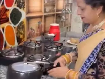 Viral Video Woman Makes Rotis In Pressure Cooker 