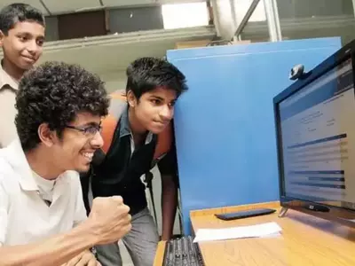 Group of students checking their Board Exam result 2024 on computer