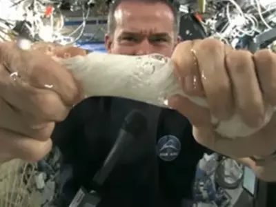 What Happens When You Squeeze A Wet Towel In Space 