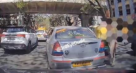 When a woman suddenly opened the door of her taxi on a busy street in Karnataka
