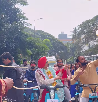 A groom and his wedding party arrive at the venue on Yulu bikes, sparking a viral video