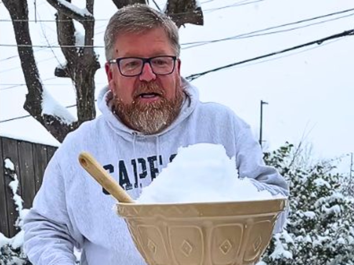 Man uses snow outdoors to create ice cream