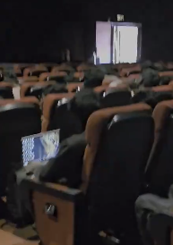 The video shows the highlight of the day in Bengaluru as a man works on a laptop in the cinema hall