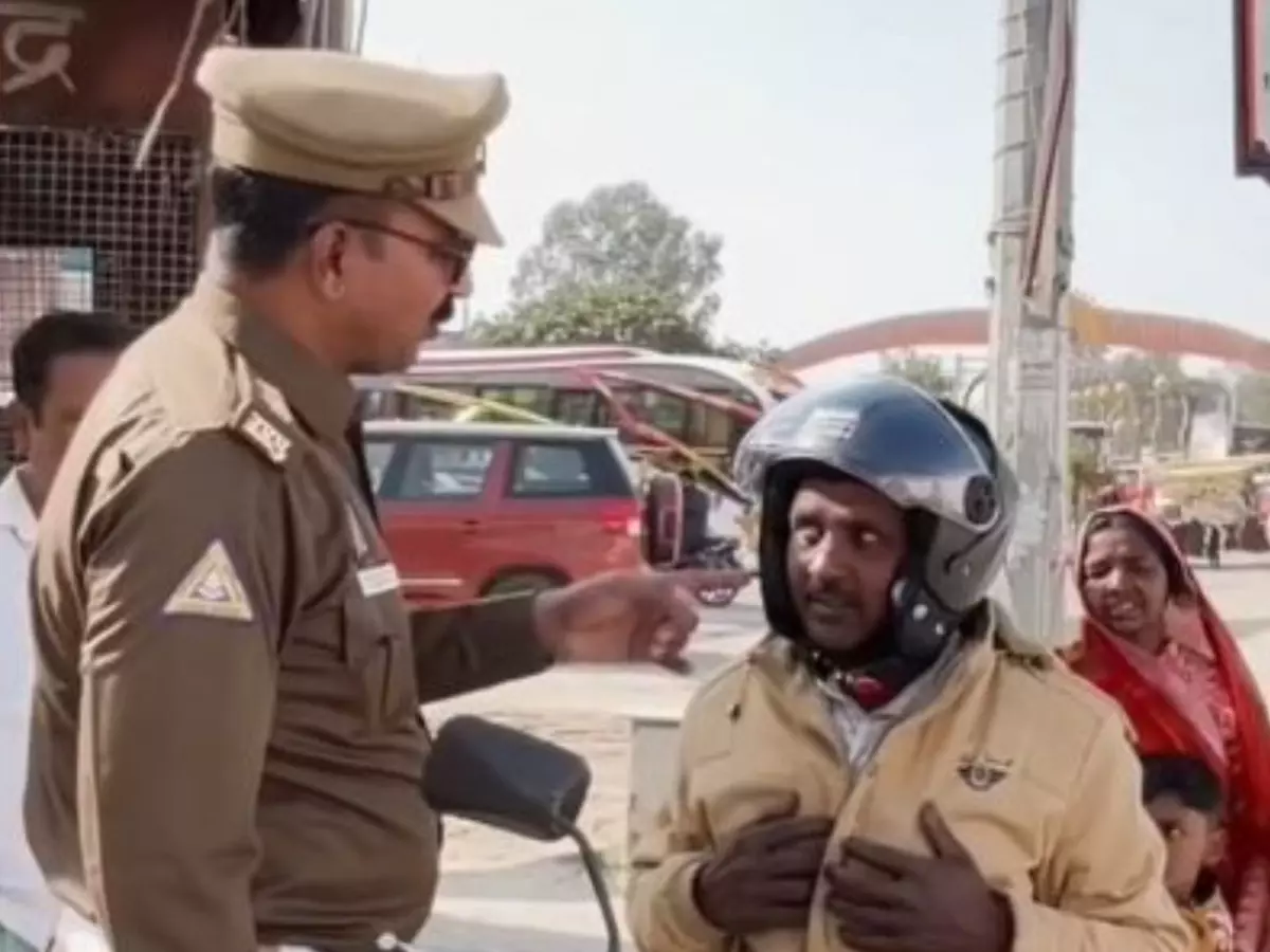 Ayodhya traffic officer wins hearts online by providing helmet to family