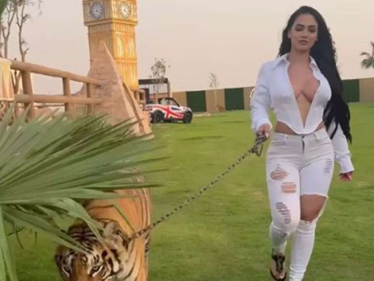 Social media influencer Nadia Khar walks a tiger in Dubai