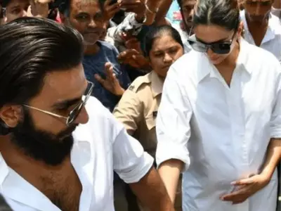 Deepika Padukone hold her baby bump with Ranveer Singh as she steps out to vote