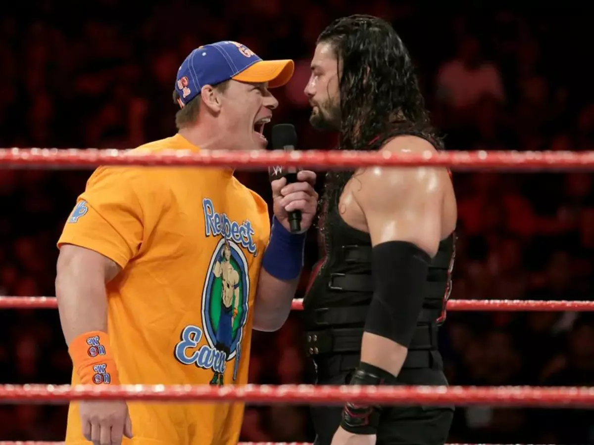 cenareigns-684a9c418f2cd John Cena (L) with Roman Reigns. | Credit: WWE