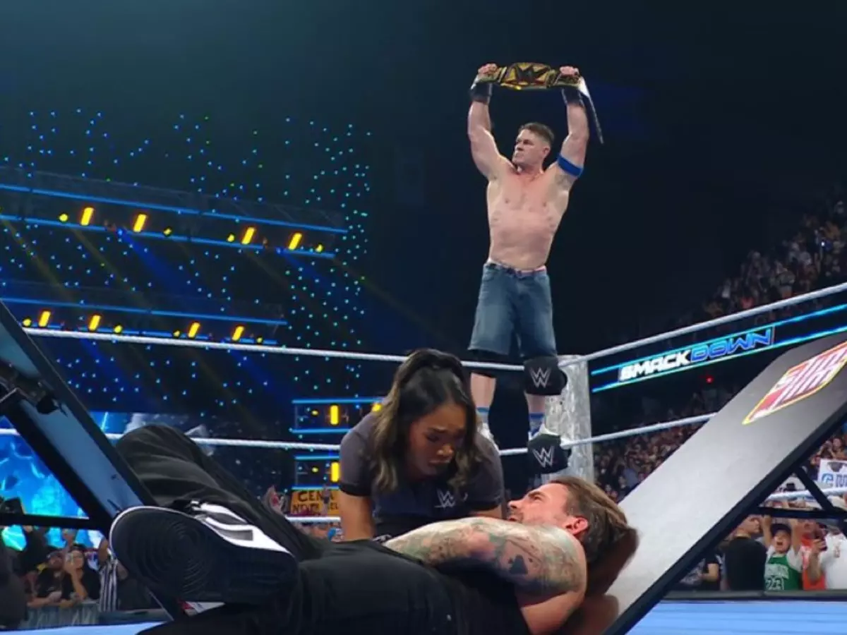 cena-685624b79f8fd John Cena stands tall after destroying CM Punk. | Credit: WWE
