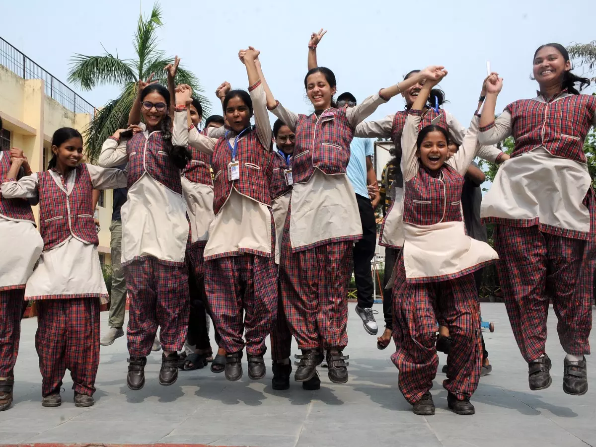 Students celebrating their success in examination result Students celebrating their success in examination result