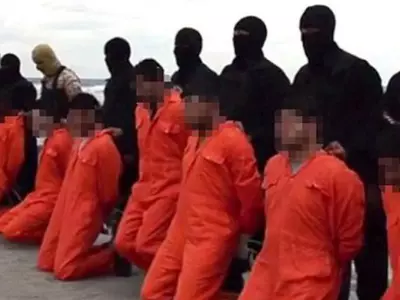 ISIS beheads 21 more