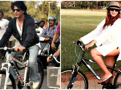 SRK and bipasha riding a cycle