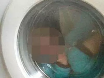 baby in washing machine | representational use only
