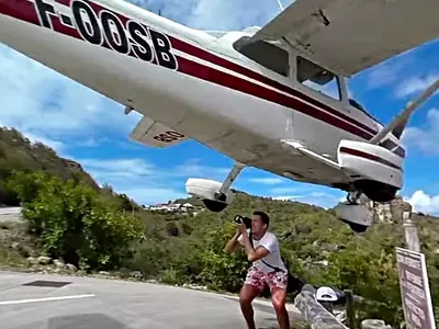 This Super Lucky Tourist Almost Lost His Head While Shooting A Low-Flying Plane!
