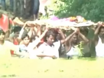 Madhya Pradesh Villagers Forced To Carry Dead Body Through A Pond