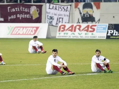 AEL Larissa players sit in protest