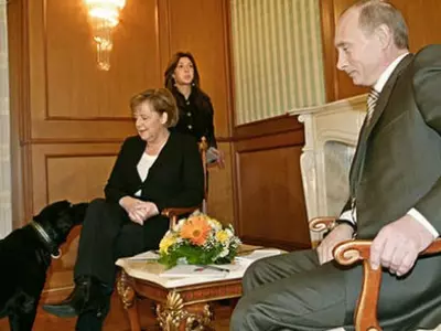 Vladimir Putin Is Trying His Best To Deny Setting His Dog Loose On Angela Merkel