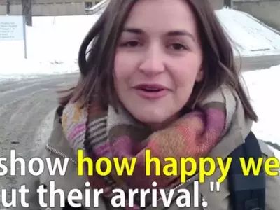 Putting Cologne Attacks Episode Behind, These German Women Welcome Refugees With Flowers