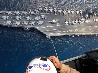 Warplanes Take Off To Fight ISIS From This Ship. It Has Starbucks, Salons