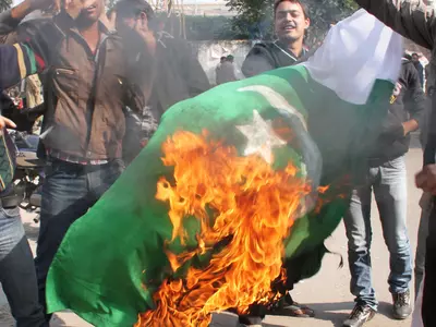 People Burn Pakistan Flag