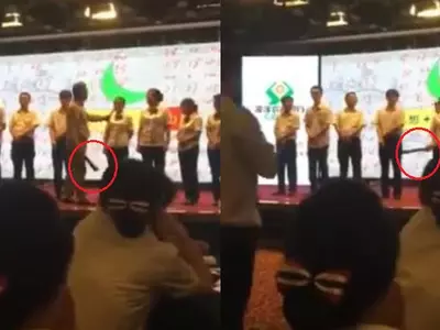 Chinese Bank Manager Unleashes His Inner Beast, Spanks Employees On Stage For Poor Performance