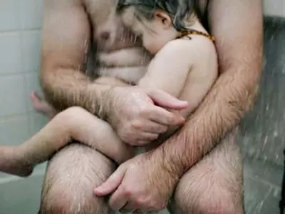 Facebook Keeps Deleting This Photo Of Dad Cradling His Sick Son In The Shower