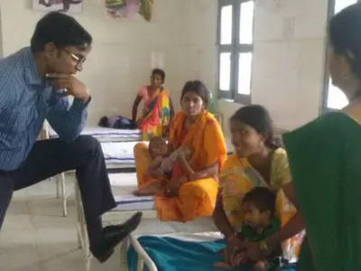 IAS Officer Caught Resting His Foot On Patient's Bed, Gets Taught A Lesson On Twitter