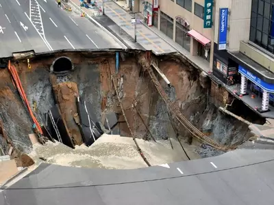 Giant Sinkhole Eats Up Most Of A 5 Lane Street In Tokyo!