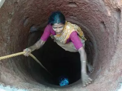 Woman Digs Water