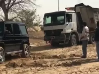 Dubai Crown Prince uses luxury Mercedes to help pull stuck lorry out of the desert