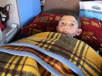 Syrian Boy Who Injured in Barrel Bomb Attack