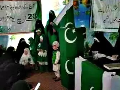 Burqa-clad women celebrate Pakistan Day