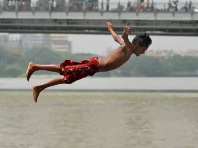 Kid Jumping in Ganga