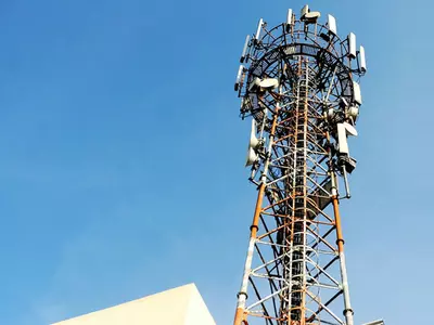 man climbs cell tower