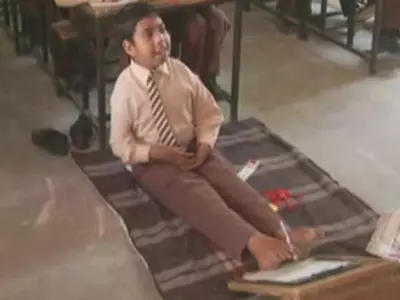 11 Year old Kamaljeet Singh writes exam with toes