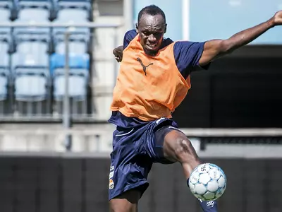 Bolt Arrives In Australia On Football Quest